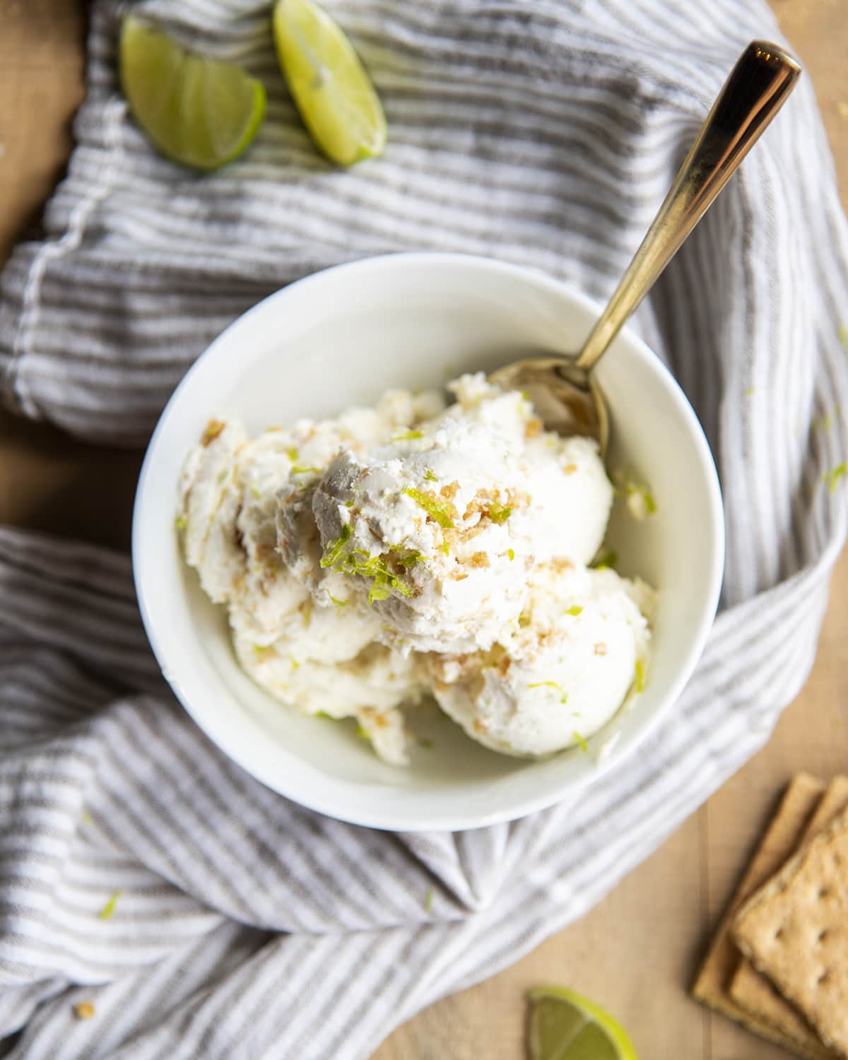 An overhead photo of a bowl of no churn key lime ice cream topped with lime zest. 