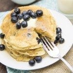 Angled view for greek yogurt blueberry pancakes on a white plate.