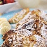 Close up view of coconut french toast on a blue plate.