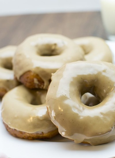 Front view of maple glazed donuts on a plate.