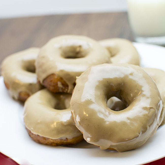 Front view of maple glazed donuts on a plate.