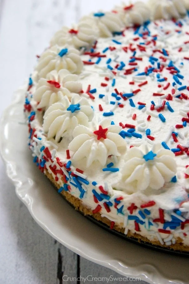 Angled view of 4th of july no bake cheesecake on a cake pan.