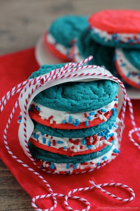 A stack of three red white and blue whoopie pie cookies tied with ribbons. 