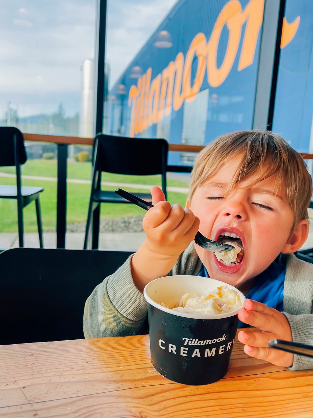 A boy eating ice cream at the Tillamook Factory.
