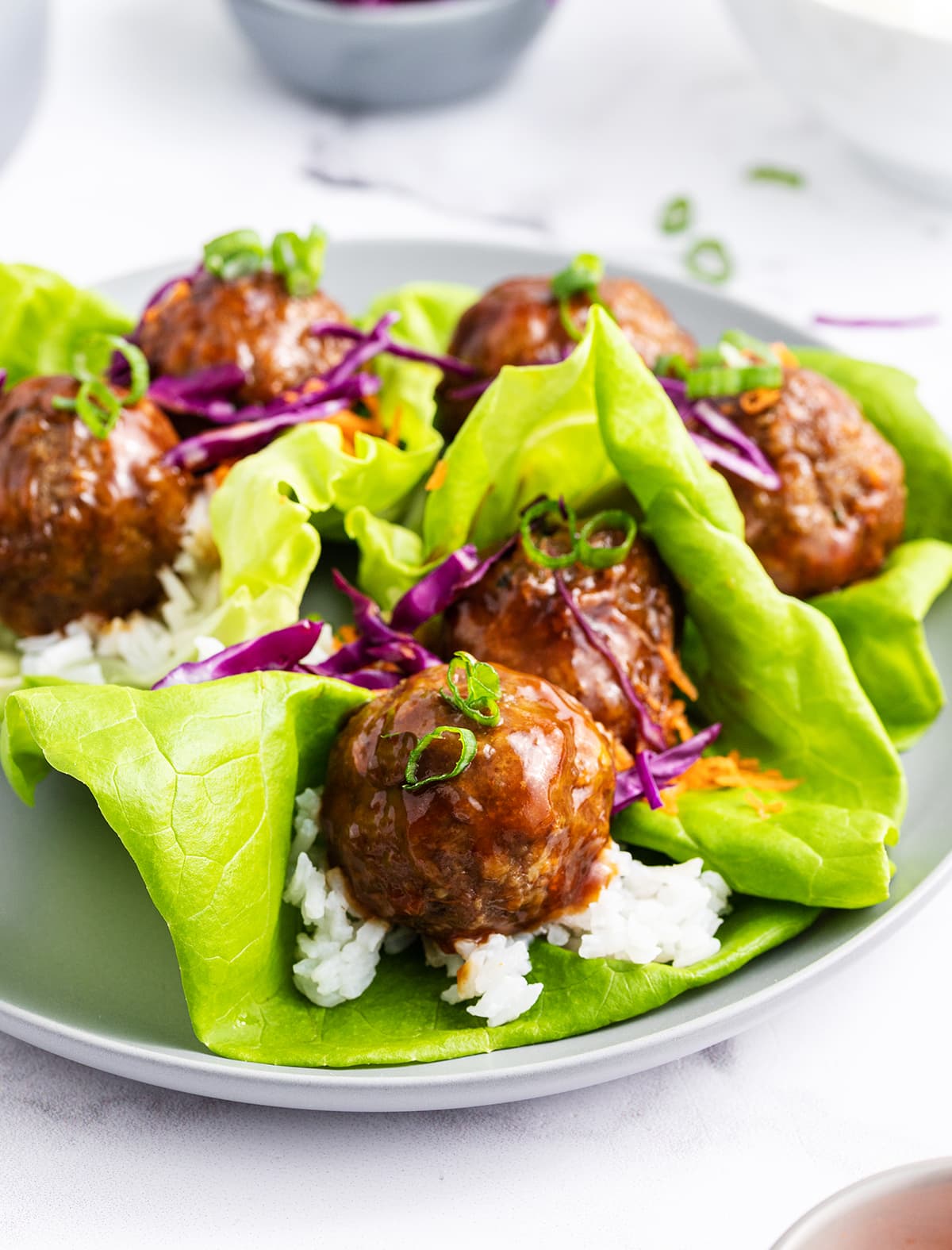 A plate of teriyaki meatball lettuce wraps.