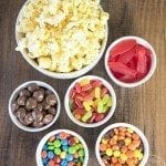 Above view of movie theater popcorn mix ingredients in a white bowl.