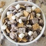 Above view of smores muddy buddies in a white bowl.