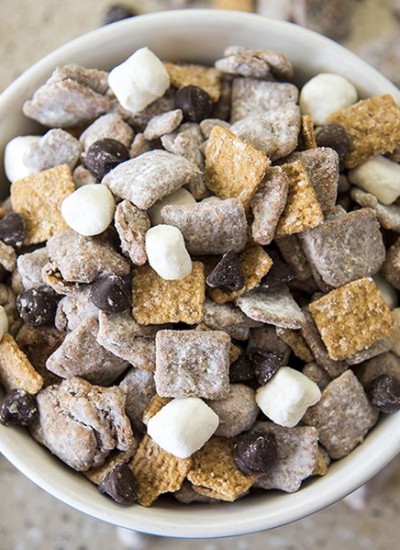 Above view of smores muddy buddies in a white bowl.