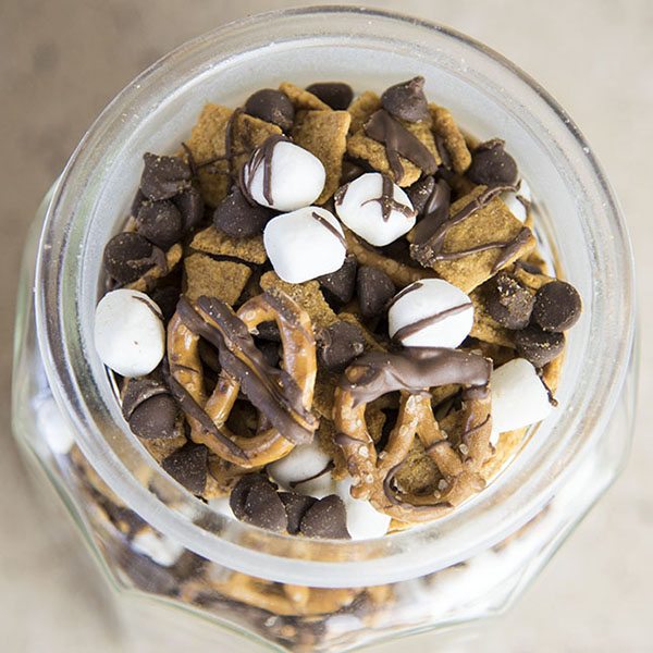 Above view of a smores snack mix in a mason jar.