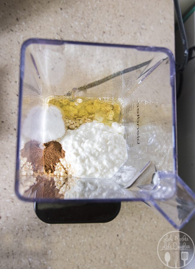 Above view of a blender with ingredients ready to be blended for biggest loser pancakes.