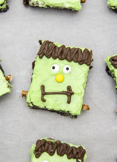 Above view of frankenstein brownies on parchment paper.