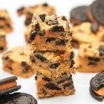Angled view of halloween cookies and cream fudge stacked on top of each other.