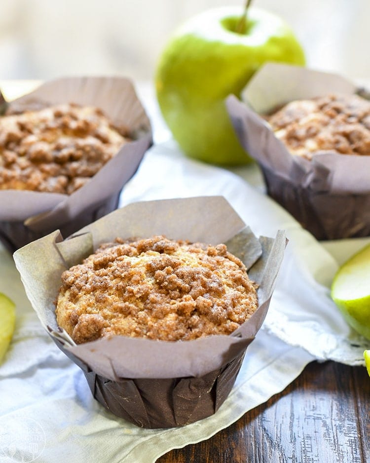 These apple crumb muffins are baked with apples and applesauce inside the muffins, then topped with an amazing cinnamon crumb streusel topping!