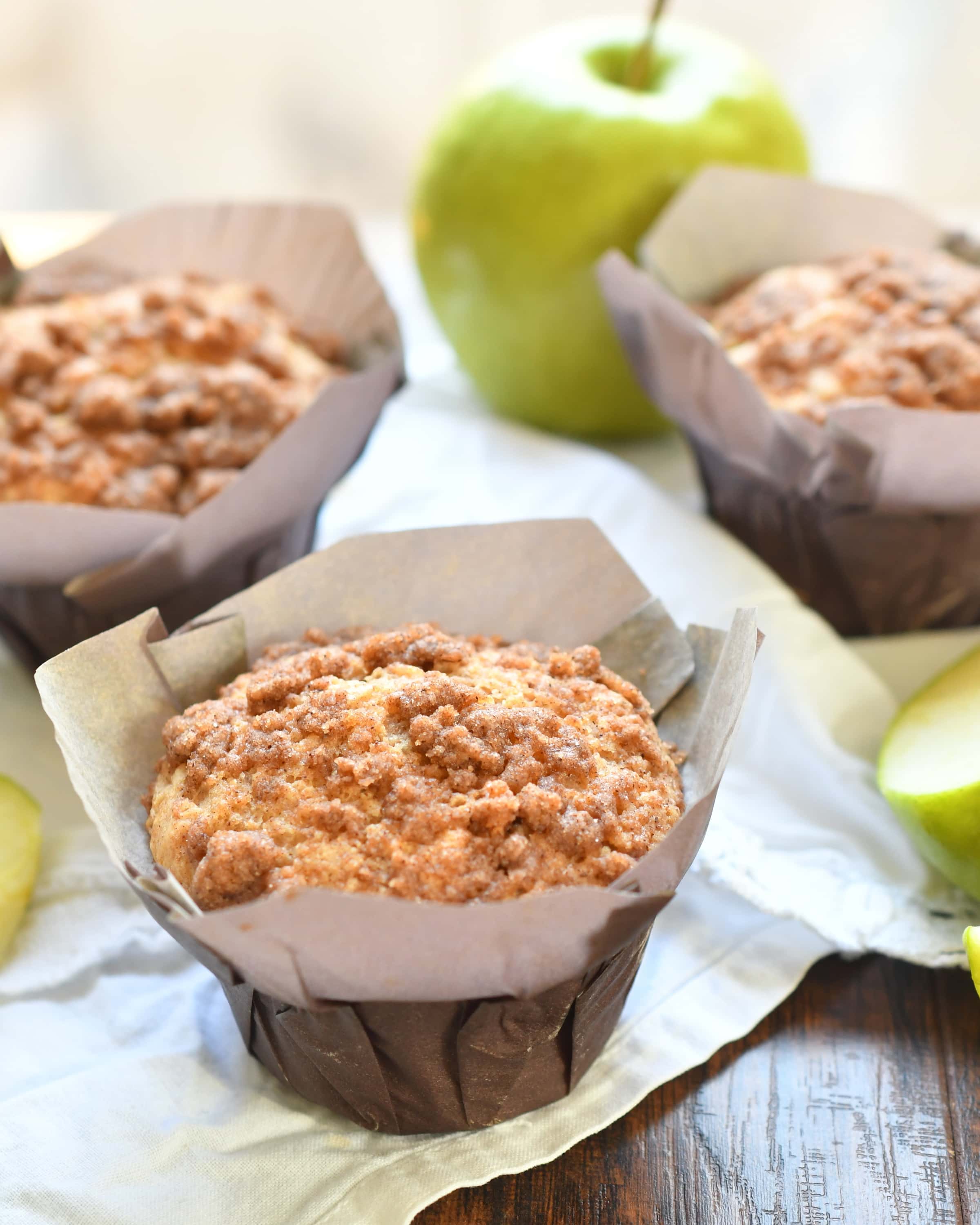 Apple cinnamon muffins baked with apples and applesauce topped with an amazing cinnamon crumb!