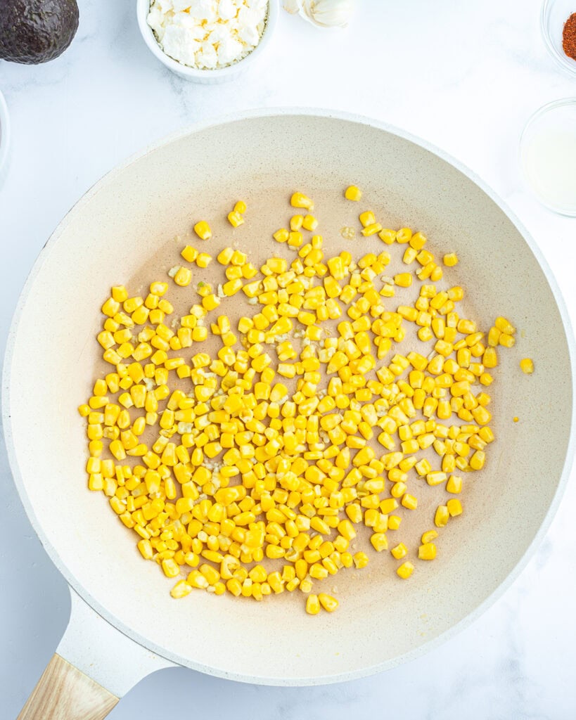 A pan of sauteed corn.