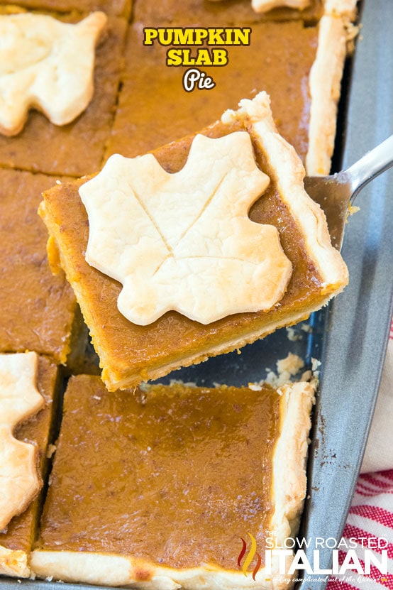 A slice of pumpkin slab pie is removed from a pan.