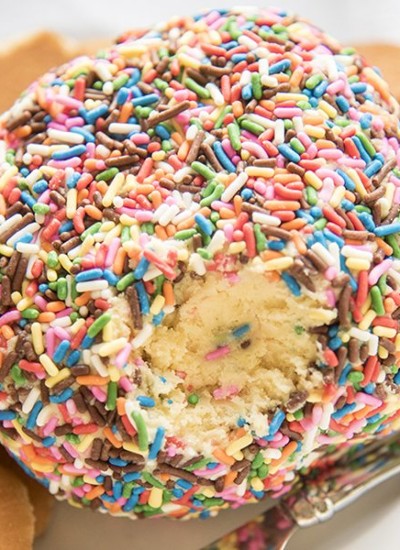 A cake batter cheeseball covered in sprinkles.