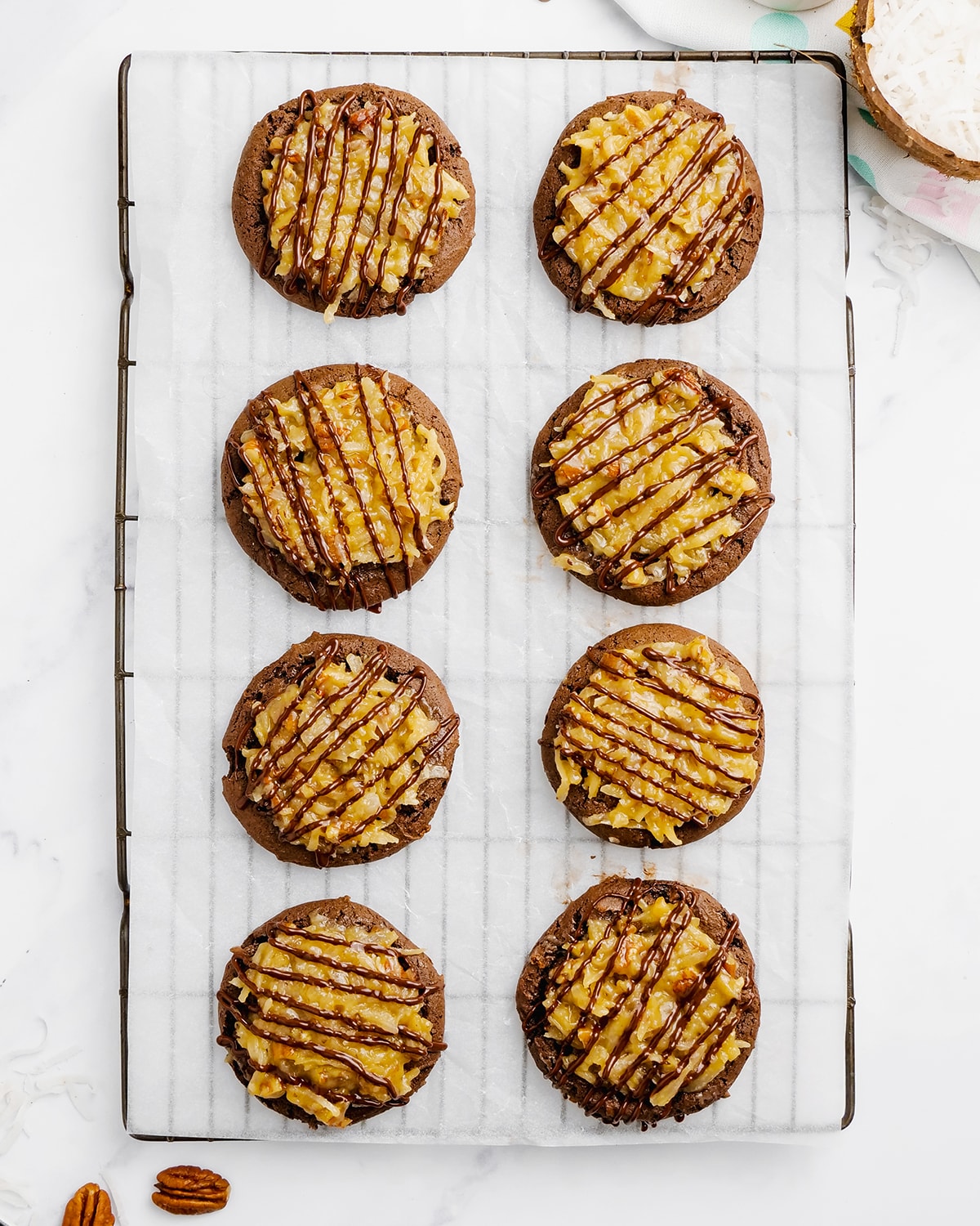 German chocolate cake cookies on a cooling sheet.