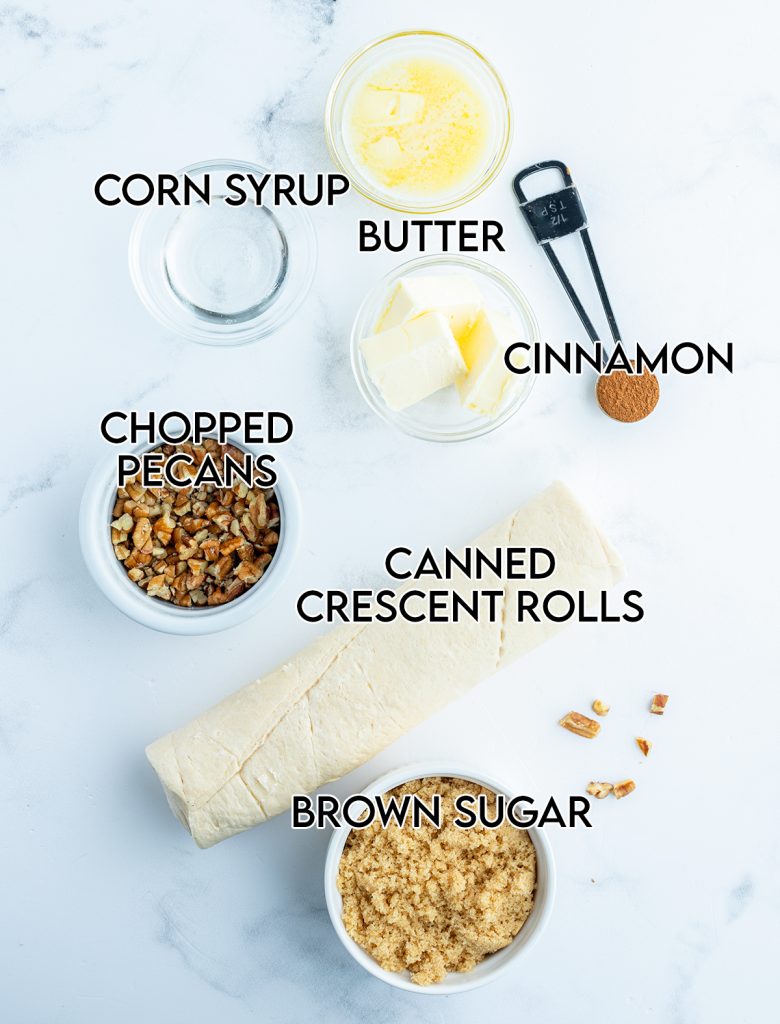 An overhead photo of the ingredients needed to make mini caramel pecan cinnamon rolls with crescent rolls.
