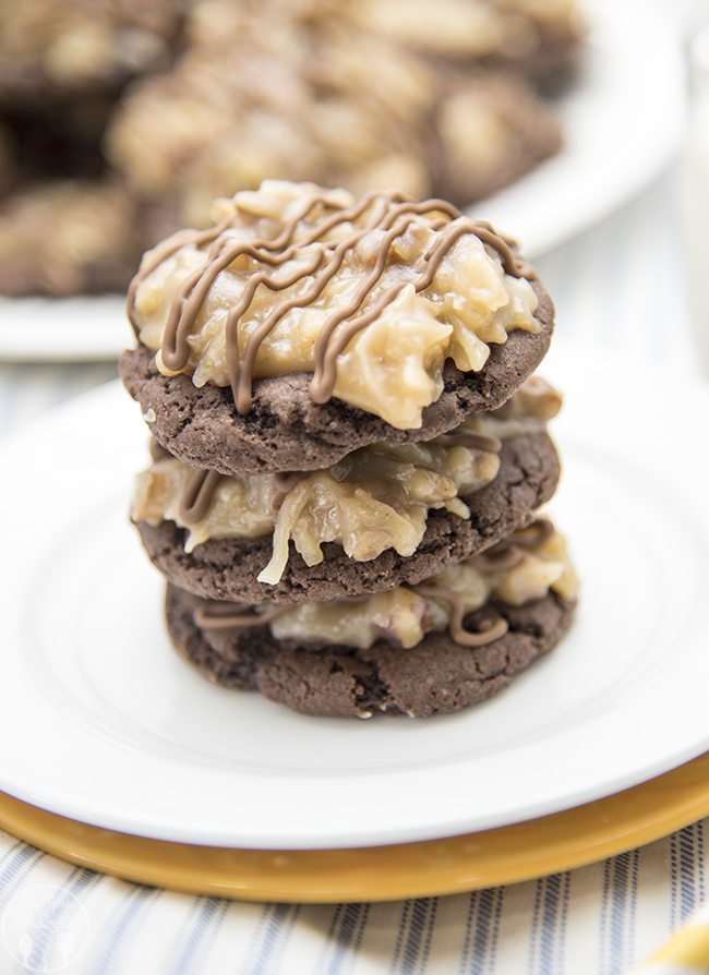 A stack of three chocolate cookies topped with German chocolate frosting.