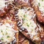 Close up of chicken parmesan with melted cheese.