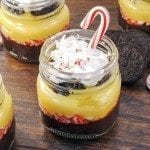 Angled view of peppermint oreo parfaits in a mason jar.