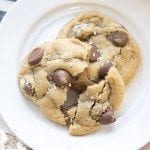 Above view of rolo stuffed chocolate chip cookies on a white plate.