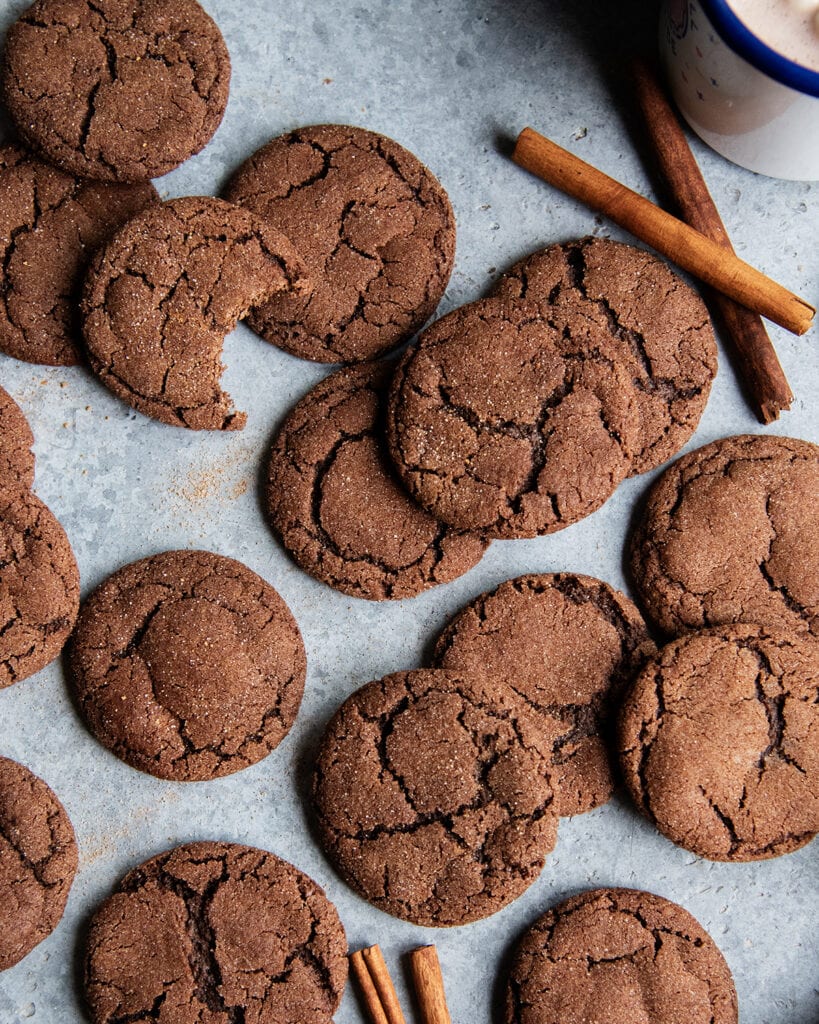 A pile of mexican hot chocolate cookies on a counter top.