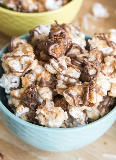 Angled image of samoa popcorn in colorful bowls.