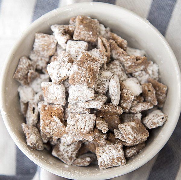 Above image of small batch muddy buddies in a white bowl.