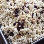 Close up image of white chocolate cranberry and macadamia popcorn mix.