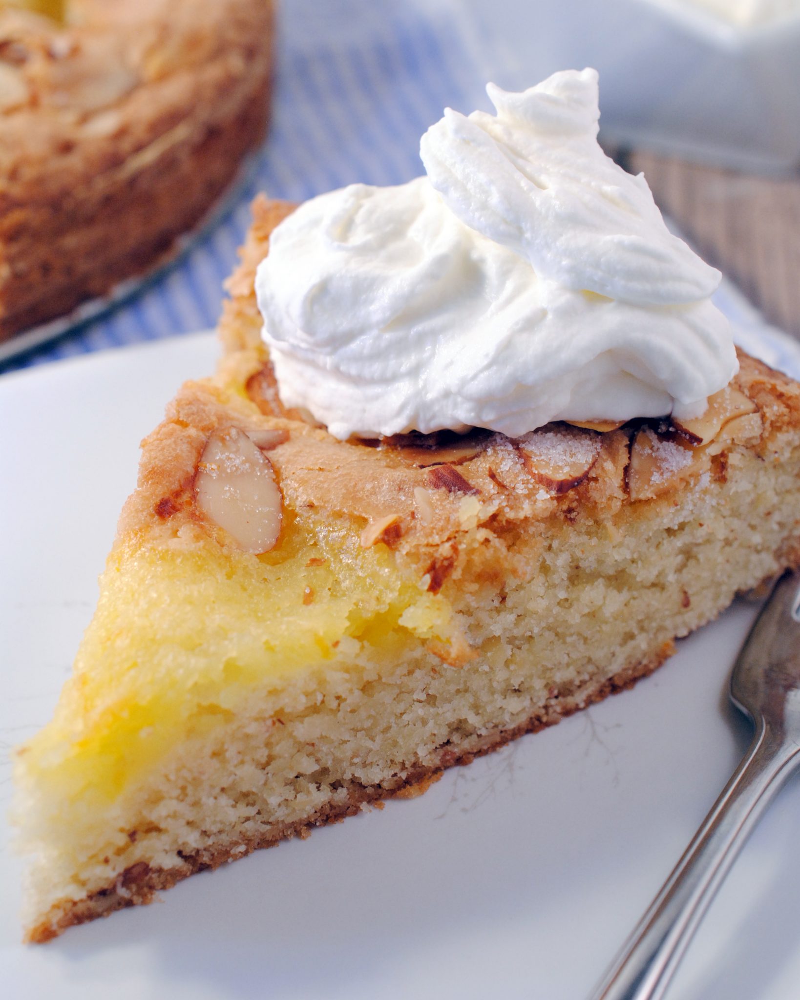 An almond lemon curd cake baked like a citrus tart with all the goodness of toasted almonds and lemon curd in a torta.