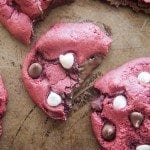 Above image of nutella stuffed red velvet cookies with filling visible.
