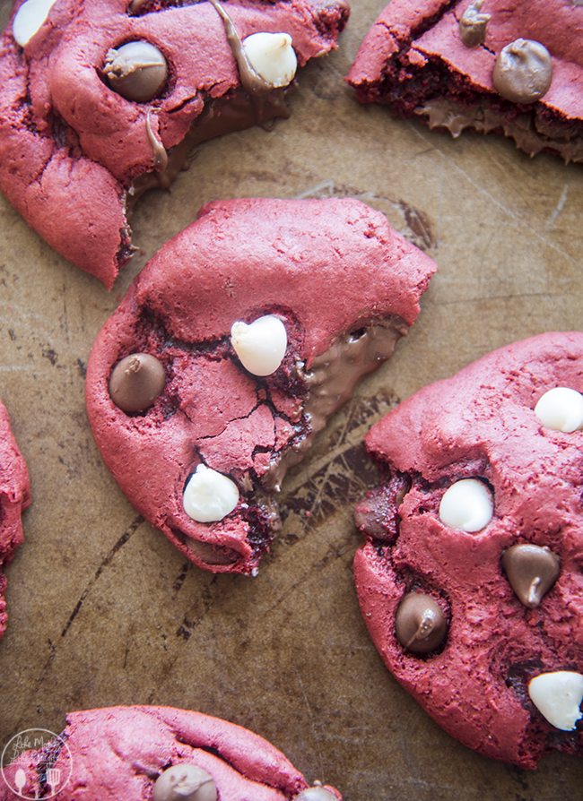 Above image of nutella stuffed red velvet cookies with filling visible.