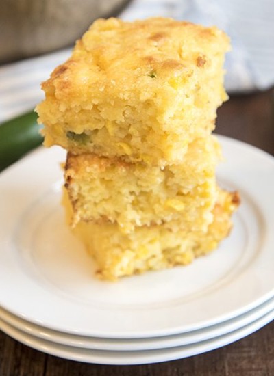Angled image of roasted jerk chicken with spinach and mozzarella.