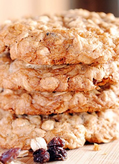 Close up image of oatmeal raisin cookies stacked up on each other.