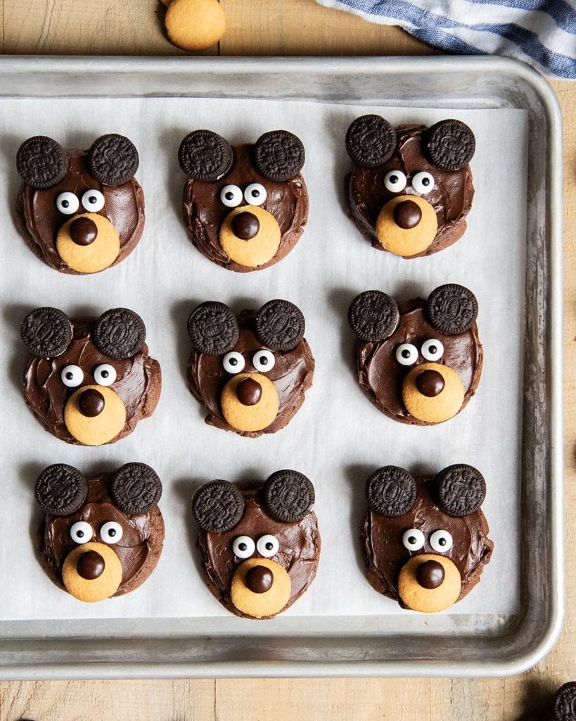 Three rows of bear cookies on a cookie sheet.