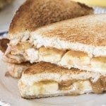 Close up image of sliced bananas foster grilled cheese sandwiches.