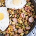 Above image of breakfast hash with eggs, sausage, potatoes, and potatoes.