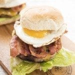 Side image of bacon and egg burger.