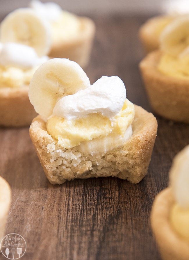Mini banana cream pie with a cookie crust, with a bite out of it. 
