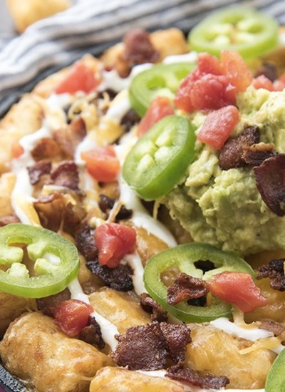 Close image of party tater tots on a white cloth.