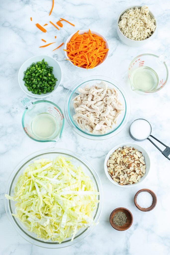 Small bowls of the ingredients needed to make Ramen Noodle Salad.
