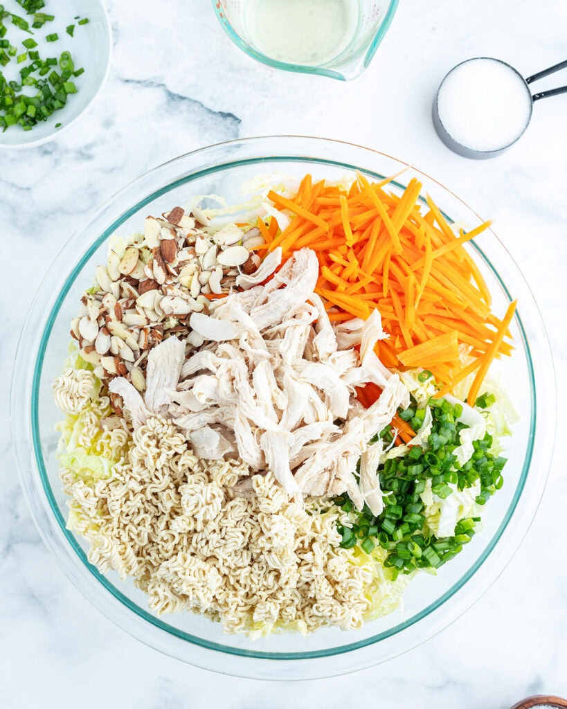A bowl of the ingredients needed to make ramen noodle salad.