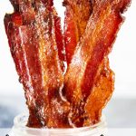 A close up of strips of brown sugar bacon in a jar with a text overlay saying "brown sugar bacon"