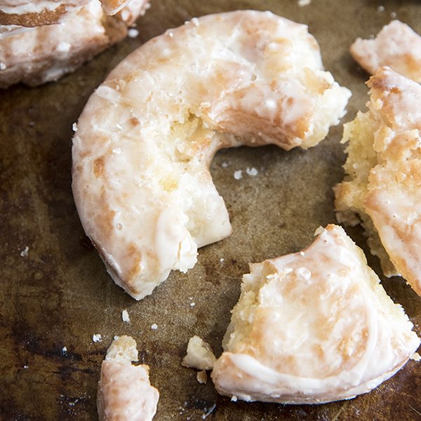 A close up of a crumbled old fashioned donut.