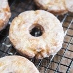 Close up image for old fashioned donuts on a cooling rack.