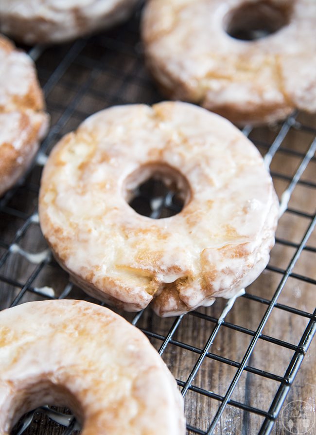 Close up image for old fashioned donuts on a cooling rack.