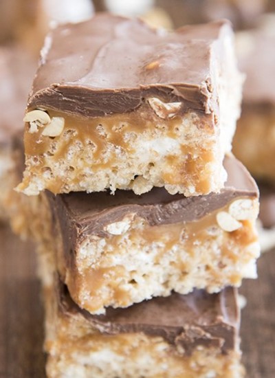 Three stacked snickers rice krispy treats.