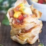 Close up image of pineapple chicken taco wonton cups.